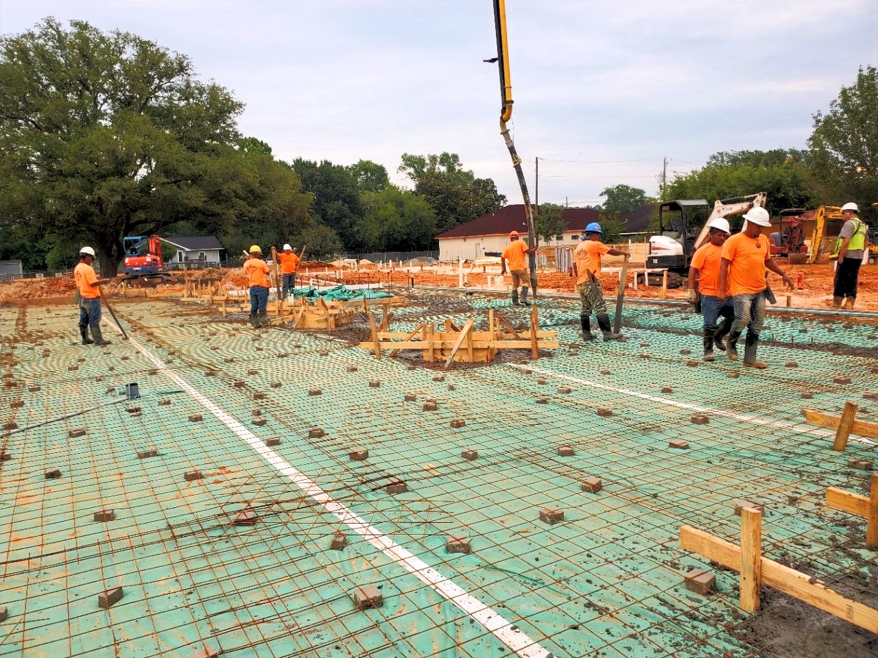 Mike Carson Construction crew tying rebar for a foundation on a residential job site
